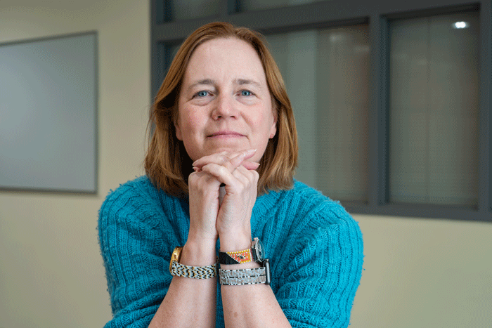 Lorelei Koss poses with watch bands she created